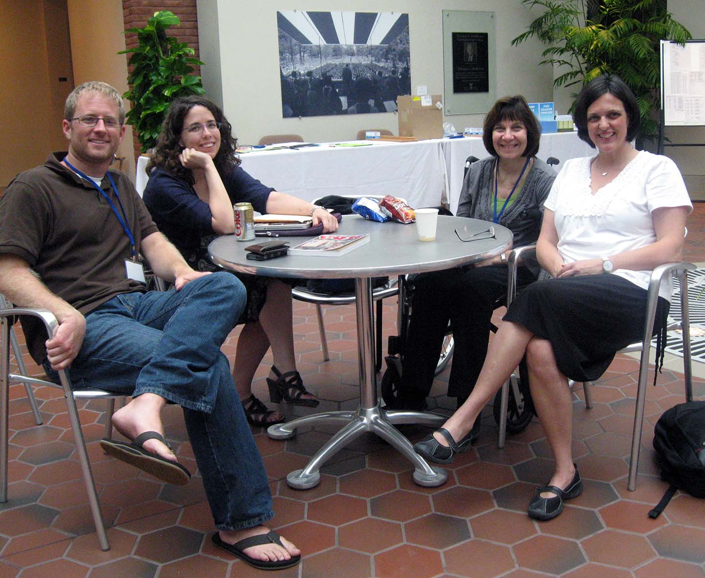 Kelsey Timmernan, Jane Friedman, Jama Bigger and Cathy Day chat in the atrium.